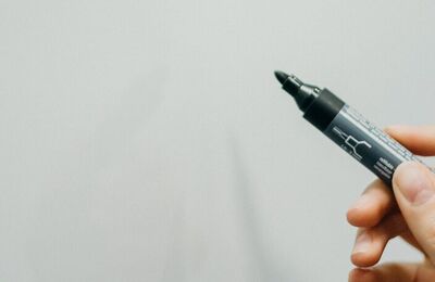 Hand holding a pen